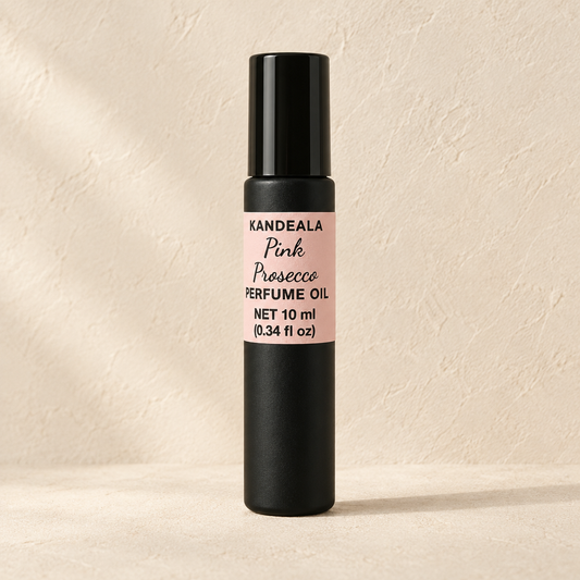 KANDEALA Pink Prosecco roll-on perfume oil on a warm beige background